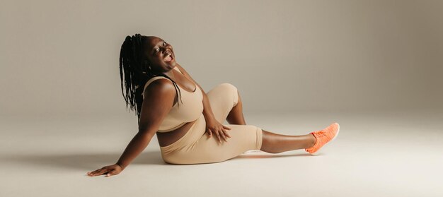Confident African woman modeling in modern fashion symbolizing body positivity