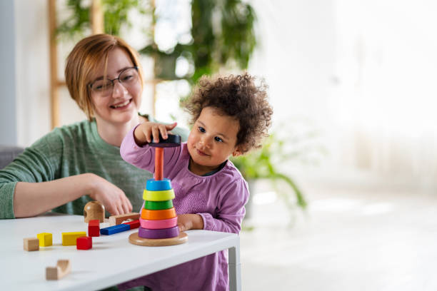 Parent helping a child pick educational toys for different developmental stages.