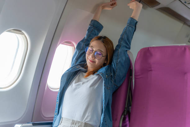 Traveler stretching after flight to feel refreshed and relaxed.